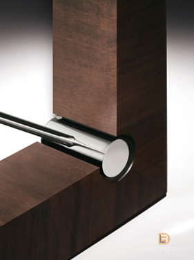 lose-up of custom dark wood furniture frame and inset detail, showcasing fine finishing craftsmanship.